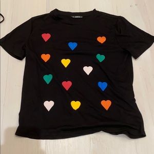 Black t with rainbow hearts